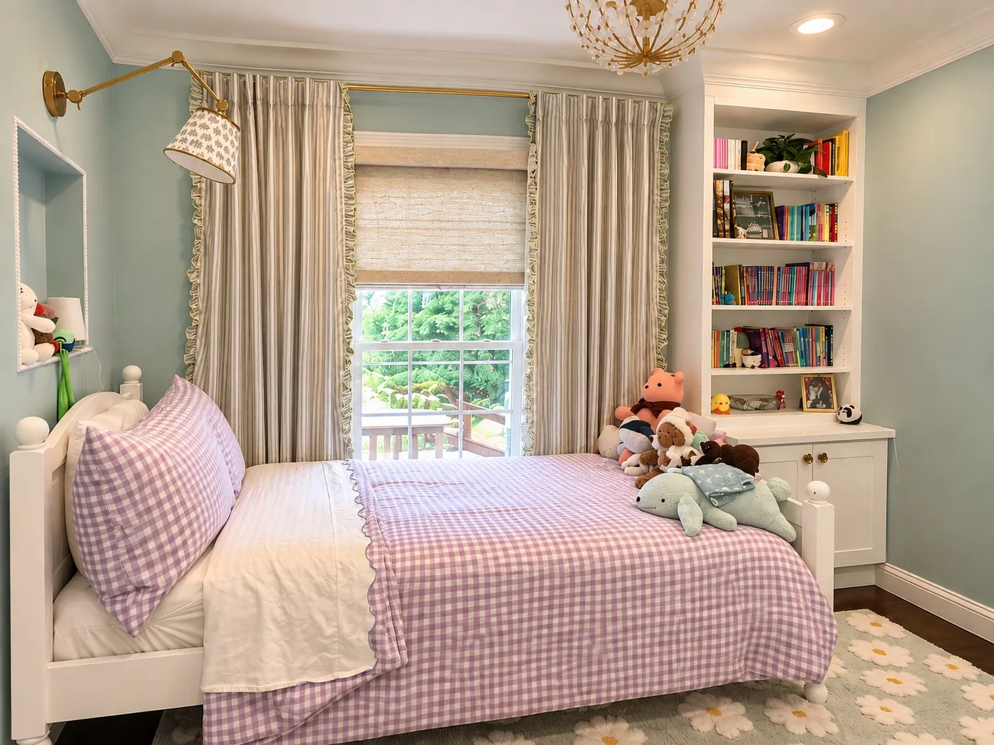 The preteen's bedroom, with built-in storage around the room and dot trim running along the crown molding